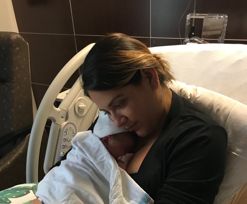Maria with her newborn in hospital