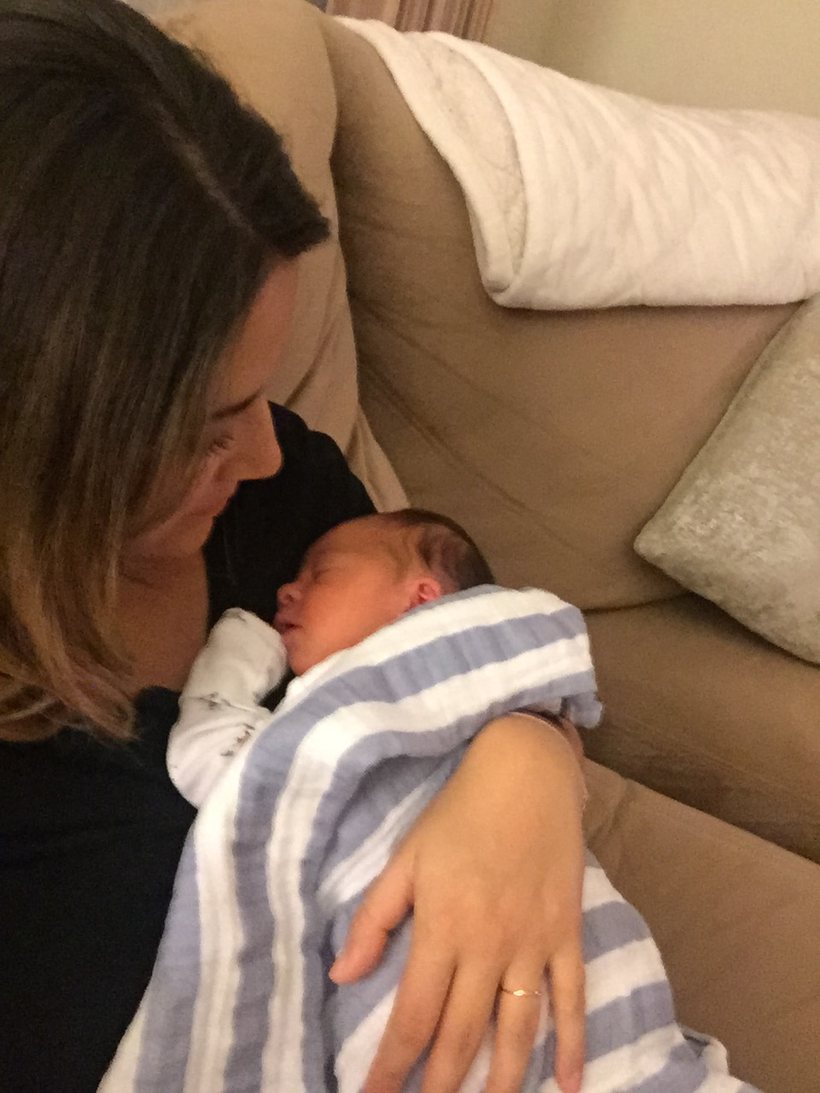 Maria Anderson holding a newborn